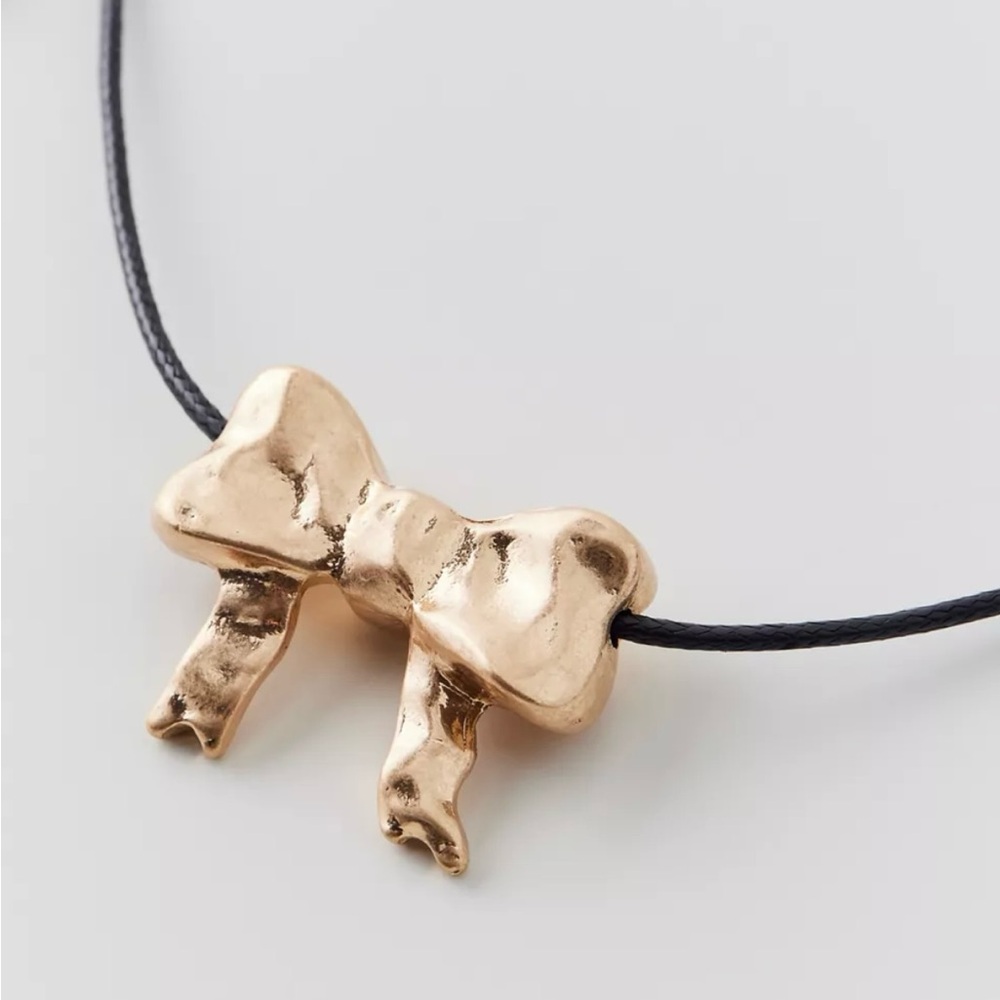 Urban Outfitters Golden Bow on a Black Cord Necklace UO jewelry
